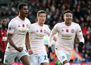 Marcus Rashford (L) celebrates with Ander Herrera (C) and Jesse Lingard after scoring the late winner against Bournemouth, Saturday