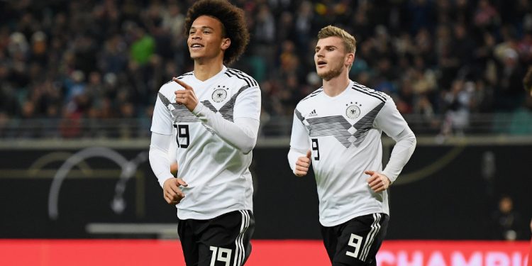 Leroy Sane celebrates Germany’s opening goal as Timo Werner (R) runs to join in against Russia, Thursday