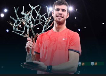 Karen Khachanov poses with the winner’s trophy after defeating Novak Djokovic in the final in Paris, Sunday