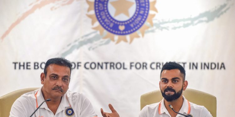 India head coach Ravi Shastri (L) and captain Virat Kohli address media persons in Mumbai Thursday before their departure for the Australia tour   