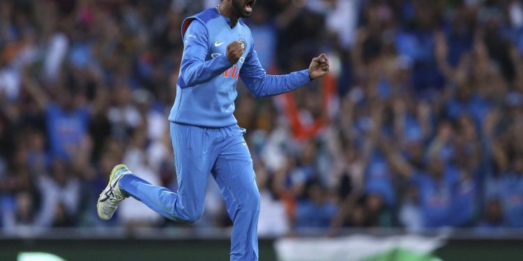 India's Krunal Pandya celebrates after taking the wicket of Ben McDermott during their third match in Sydney, Sunday