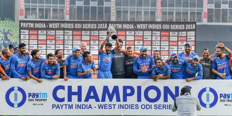 Ravindra Jadeja (with beard) is all smiles as he celebrates with teammates after dismissing a Windies batsman, Thursday