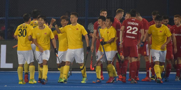 China players (in yellow) celebrate one of their goals against England at the Kalinga Stadium, Friday