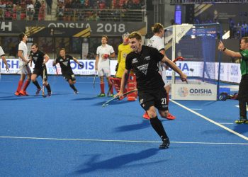 Stephen Jenness wheels away in celebration after scoring the winner against France at the Kalinga Stadium, Thursday