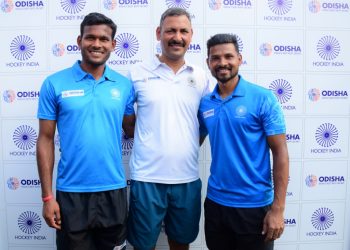 Amit Rohidas, Birendra Lakra and Harendra Singh pose for photographs after the media interaction in Bhubaneswar, Saturday     