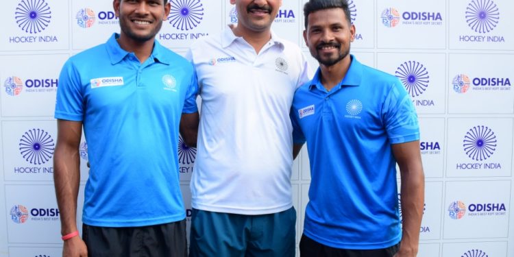 Amit Rohidas, Birendra Lakra and Harendra Singh pose for photographs after the media interaction in Bhubaneswar, Saturday     