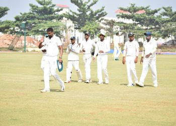 Basant Mohanty leads Odisha team to the pavilion after getting the six-wicket haul against UP at KIIT Stadium in Bhubaneswar, Wednesday 