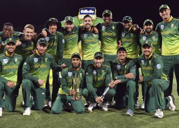 South Africa players pose with the winners’ trophy, held by Imran Tahir, at Hobart, Sunday