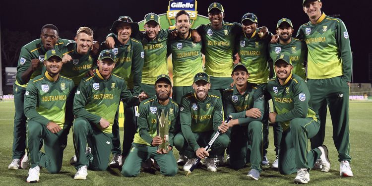 South Africa players pose with the winners’ trophy, held by Imran Tahir, at Hobart, Sunday