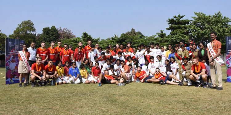 England players and officials with students of Sai International School in Bhubaneswar, Wednesday