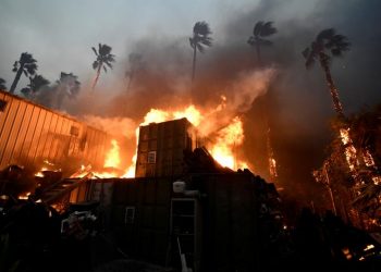 A home is engulfed in flames during the Woolsey Fire in Malibu, California, Friday. REUTERS