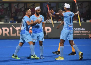 Simranjeet Singh (C) celebrates after scoring one of his two goals against South Africa at the Kalinga Stadium, Wednesday