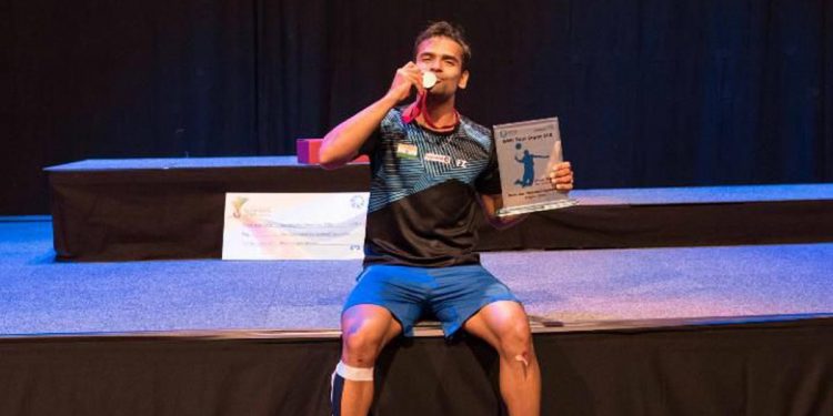 Subhankar Dey poses with his medal and memento after his win at Saarbrucken in Germany, Sunday