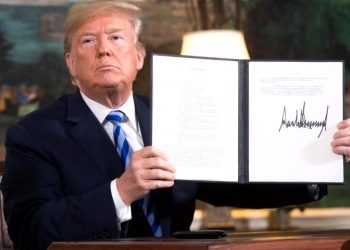 File photo of US President Donald Trump signing a document reinstating sanctions against Iran after announcing the US withdrawal from the Iran Nuclear deal, in the Diplomatic Reception Room at the White House in Washington, DC, on May 8, 2018. PHOTO: AFP