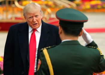 A military band leader salutes U.S. President Donald Trump during a welcome ceremony at the Great Hall of the People in Beijing, China November 9, 2017. REUTERS/Jonathan Ernst