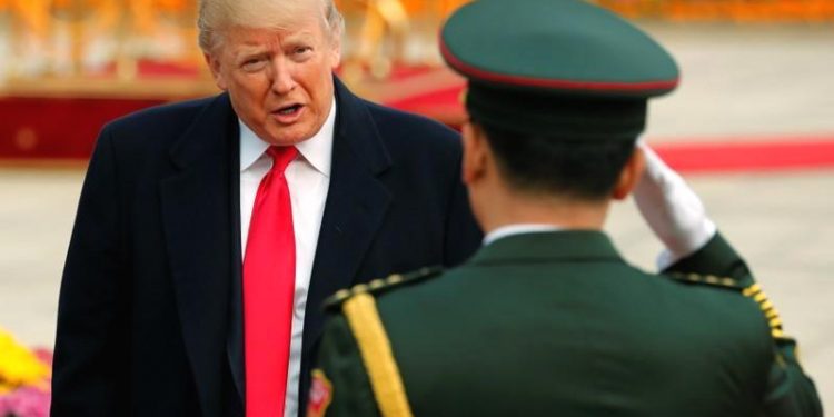 A military band leader salutes U.S. President Donald Trump during a welcome ceremony at the Great Hall of the People in Beijing, China November 9, 2017. REUTERS/Jonathan Ernst