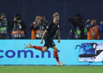 Tin Jedvaj wheels away in celebration after scoring the late winner against Spain in Zagreb, Thursday