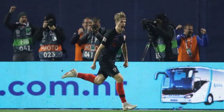 Tin Jedvaj wheels away in celebration after scoring the late winner against Spain in Zagreb, Thursday