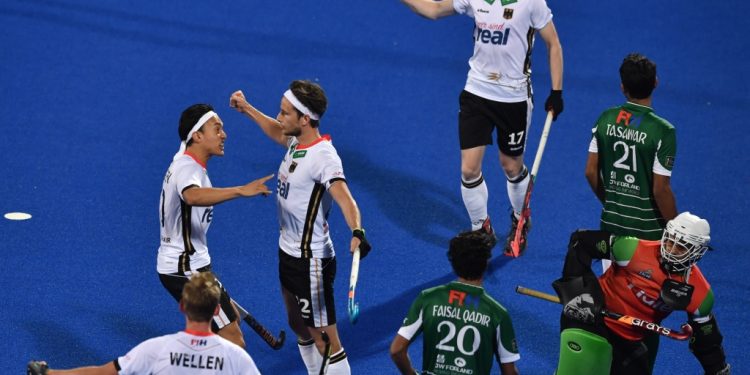 Germany players (in white) celebrate after scoring the winners against Pakistan at Kalinga Stadium, Saturday