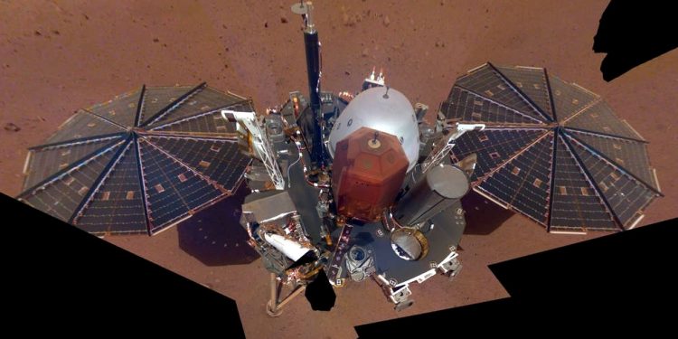 This is NASA InSight's first selfie on Mars. It displays the lander's solar panels and deck. On top of the deck are its science instruments, weather sensor booms and UHF antenna. The selfie was taken on Dec. 6, 2018 (FILE PHOTO)