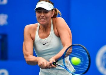Five-time Grand Slam champion Maria Sharapova returning Timea Bacsinszky at the Shenzhen Open.