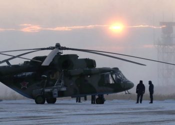 A search and rescue helicopter are seen before a flight to the landing area of the Soyuz MS-09 capsule with the International Space Station (ISS) crew onboard during sunrise in the town of Zhezkazgan, formerly known as Dzhezkazgan, Kazakhstan, Thursday, Dec. 20, 2018. (AP)