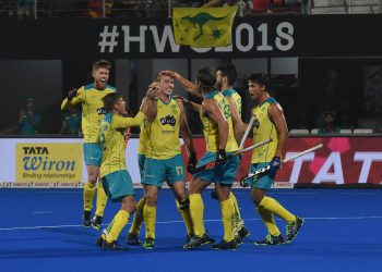 Australia players celebrate after scoring a goal against France at the Kalinga Stadium