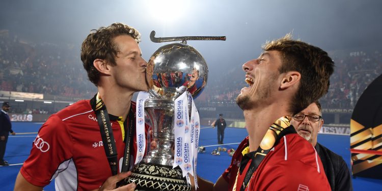 Belgian players celebrate with the hockey World Cup Sunday