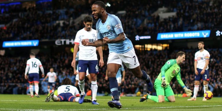 Raheem Sterling wheels away in celebration after scoring Man City’s winning goal against Bournemouth, Saturday