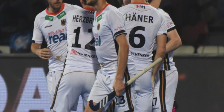 Germany players celebrate one of their goals against Malaysia at the Kalinga Stadium, Sunday