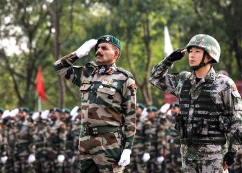 Indian and Chinese soldiers salute at the starting ceremony of the Hand-in-hand India-China Anti-Terrorism Joint Training Exercise in Pune, India, on Nov. 17, 2014. (PTI)