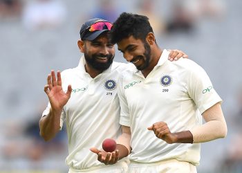 Mohammed Shami and Jasprit Bumrah share a laugh during India’s third Test in Melbourne