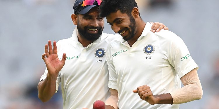 Mohammed Shami and Jasprit Bumrah share a laugh during India’s third Test in Melbourne