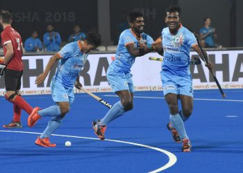 Amit Rohidas (R) celebrates with teammates after scoring against Canada at Kalinga Stadium, Saturday 