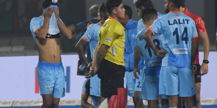 Dejected India players after their loss against Netherlands in the Men's HWC quarterfinal at the Kalinga Stadium, Thursday