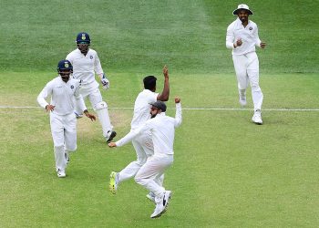 Indian skipper Virat Kohli (C) leads the celebration after the team’s victory over Australia at Adelaide Oval, Monday