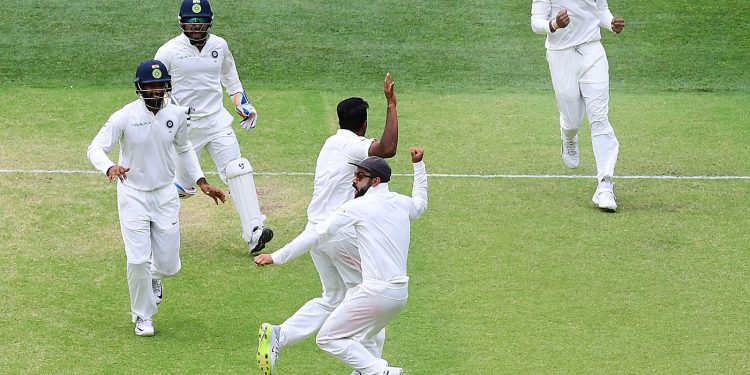 Indian skipper Virat Kohli (C) leads the celebration after the team’s victory over Australia at Adelaide Oval, Monday