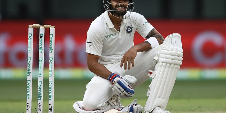 Virat Kohli reacts after diving to make his ground during day two of the second match against Australia at Perth Stadium