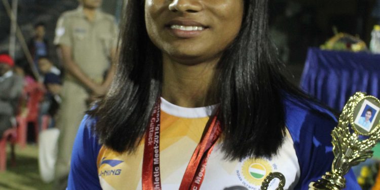 Dutee Chand poses with her medals and best women’s athlete trophy in Cuttack, Sunday   