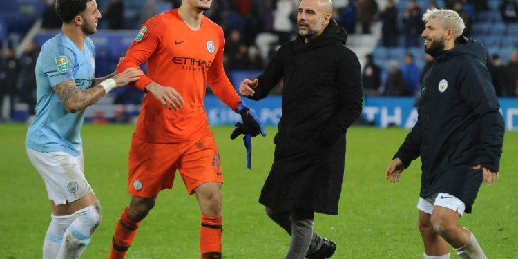 (From L): Kyle Walker, Arijanet Muric, Pep Guardiola and Sergio Aguero celebrate in front of fans after a Manchester City victory