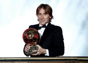 Luka Modric poses with the Ballon d'Or trophy at Paris