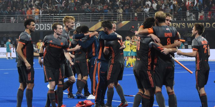 The Dutch players celebrate after their semifinal victory against Australia in the Men's Hockey World Cup at Kalinga Stadium