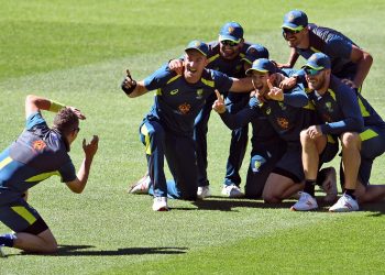 Australian players look in good spirits ahead of Melbourne Test as they share a light moment during the team’s training session, Monday