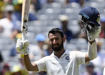 Cheteshwar celebrates scoring a century against Australia in Melbourne