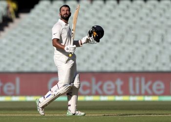 Cheteshwar Pujara celebrates after reaching a century against Australia in Adelaide