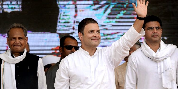 Congress President Rahul Gandhi waves at crowd during a public meeting in Jhalawar, Rajasthan, Wednesday, Oct 24, 2018. RPCC President Sachin Pilot and former CM Ashok Gehlot are also seen. (PTI)