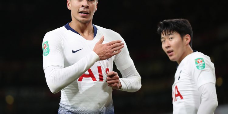 Dele Alli (L) celebrates his goal against Arsenal as other Tottenham goal scorer Son Heung-min looks on