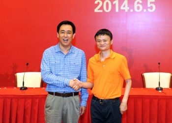 Xu Jiayin, China's richest man with Alibaba co-founder Jack Ma (R)