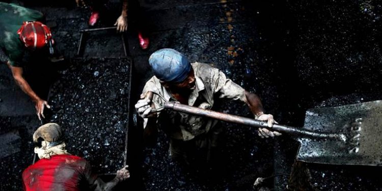 Coal workers digging for coal in a seventy feet deep rathole mine in the Jaintia Hills in Meghalaya. (YOUTUBE)