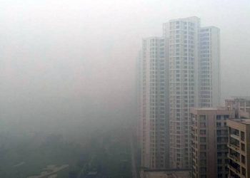 A residential building is shrouded in smog in New Delhi, India, December (REUTERS)